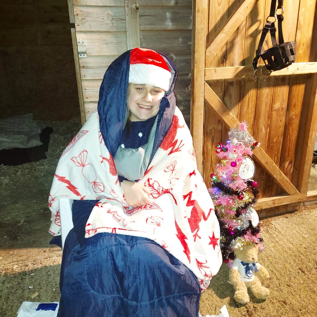 Izzy with lots of layers at sleep out 2020
