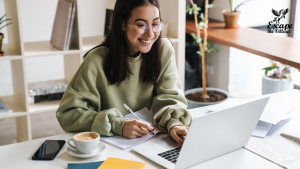 Cassie on her laptop, their apprentice